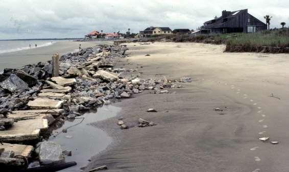 1989 The northern channel of North Edisto Inlet is forced shoreward by the shoal off Renken Point, causing dangerous encroachment along the seawall (Fig T-8).