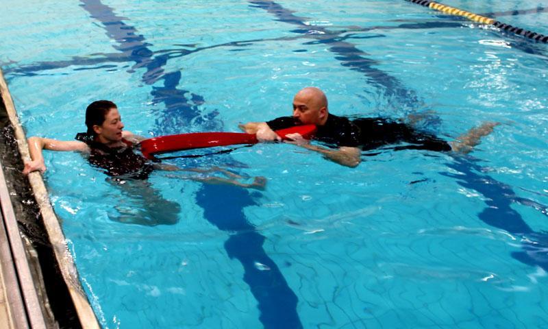 Swim Extension from in the Water If a lifeguard cannot reach the victim from the pool deck, a swim extension rescue can be used. Approach the victim from the front and extend the rescue tube.