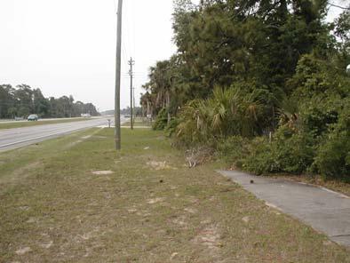 Looking south along the west side of US 1, north of Volco Road: a short section of sidewalks exists along one property. Looking north along US 1 from just north of the intersection of Roberts Road.