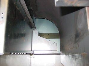 The small notch in each side of the venturi visible externally from the burner body is for the front to back location and should be located up into the top corner panels when pushing up at the burner
