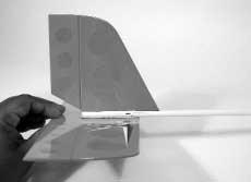 Step 8. Slide the vertical fin and rudder assembly into the slot at the rear of the tail boom.