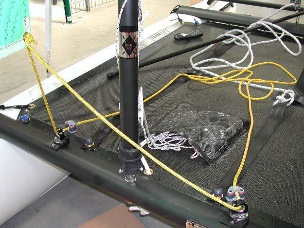 Take the yellow jib sheet and pass one end through one of the jib sheet cleats