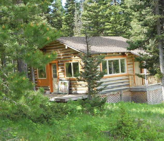 The Residences The main house at Hidden Ridge is the impressive three story pine log structure, hidden in a copse of pine and fir trees, and