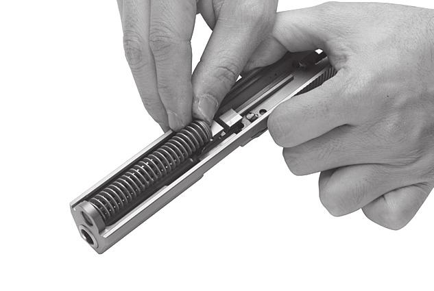 l Hold the slide upside-down. Place the barrel inside the slide with the locking lugs oriented as shown in 4.1 Fig. 5.