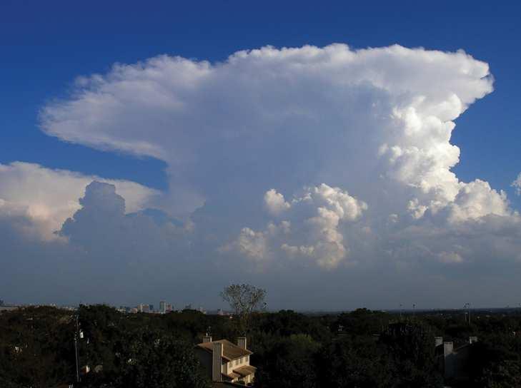 Cumulonimbus (High vertical columns of clouds, usually with an anvil shaped top).