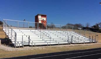 This bleacher is 6 long and seats 4 with a comfortable 8 wide Elite Seat in team color. Note the color risers and aisle at the end of the bleacher. Roof structure by others.