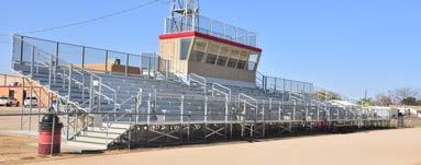 Features an optional sloped front 8 x 30 pressbox. Visitor s side is a 69 0 Row Elevated Angle Frame bleacher that seats 377. Both bleachers offer optional wheelchair seating and ADA ramps.