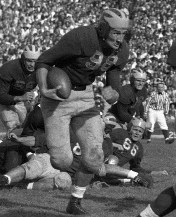 Special thanks to Greg Kinney, athletics archivist bl008233 Old 98 : Tom Harmon barrels ahead against Michigan State in 1940.