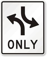 Signs and roadway markings (painted on the road in the median) would be a great help to eliminate confusion.