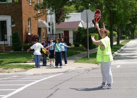 From this position, guard signals the AAA School Safety Patroller to release students to cross, using the spoken command