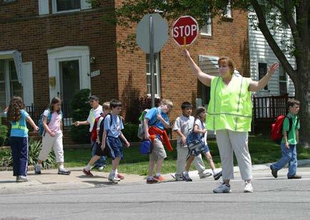 It is imperative that the crossing guard remain in position until the last student has crossed.