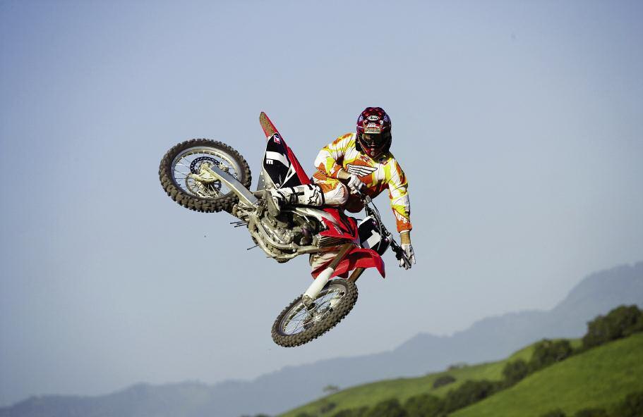 FMX Motocross racing takes riders over rough, off road terrain with steep jumps and bumps.