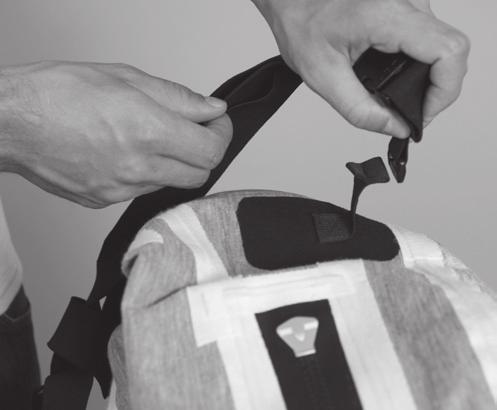 Suspenders can be adjusted to a comfortable and secure position. 1. Completely unzip the entry zipper.