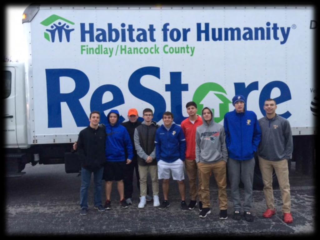 Findlay High School Hockey Team helped Habitat for Humanity load and unload granite countertops.