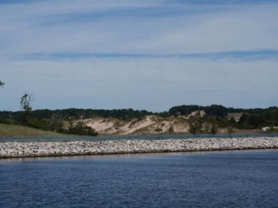 The state park has a beach and dunes on the west side of the channel and a campground