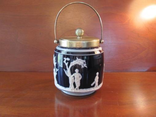 A Doulton Lamberth 6 stoneware mug of waisted shape, and the sides are decorated with golfing figures in relief with a silver rim, in excellent condition