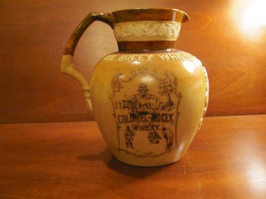 A Colonel Bogey Whiskey Jug by Doulton Lambeth, England, Circa 1904, a rare golf pottery collectible, in vg condition.. Sale price @ $1,500 Photo #3676, Lot #13 Photo #3677, Lot #14 14.