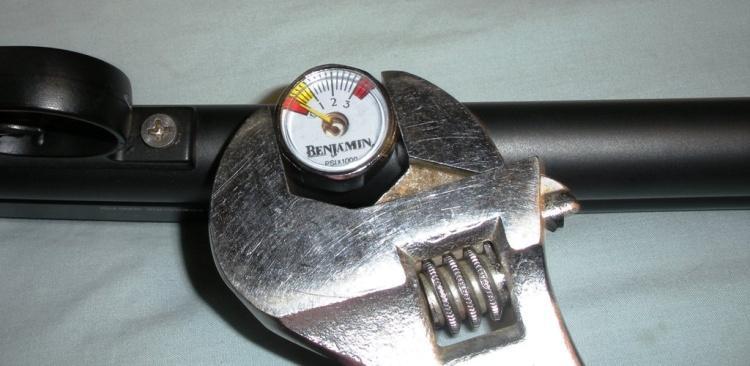 Use a 5/8 wrench to turn the adapter while holding the gauge with a crescent wrench.