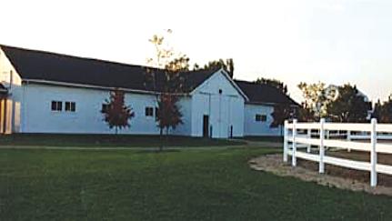 Main barn of Ariel view of Photo of riders and horses from Farm 1 at a