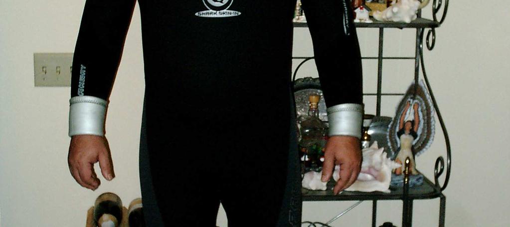 A wetsuit shields the diver from heat loss by controlling the amount of water that comes in contact with the diver, limiting it to just enough to allow the divers own warmth to keep the water warm.