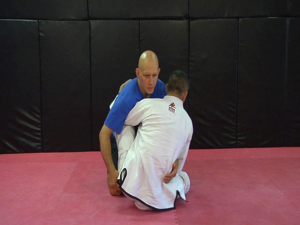 So when you re using the knee-to-nose position and driving forwards, forcing his hips off of the ground, be sure to also control the hips by caging them in mid-air with your knee or a grip on the