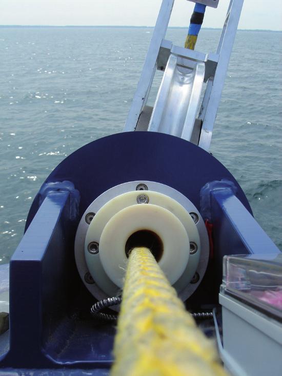 T U R N W I N D I N T O P R O F I T A coupling mechanism connects the towing kite with the kite adapter attached to the launch and recovery mast.