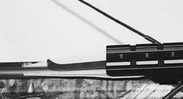 Slide the bolt back into the string under the arrow retention spring until it makes complete contact with the string. The crossbow is now loaded. Handle with extreme care. 2.