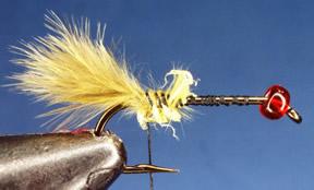 5. Wind thread tightly over the feathers to secure them. Trim excess feather in font of tie down point.