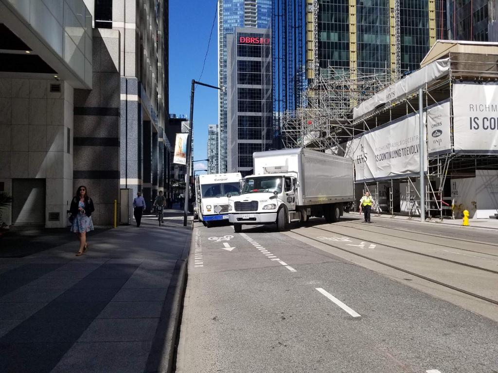 Adelaide Street West Issues and Concerns Existing courier delivery zone/truck queuing are adjacent to the curb on the south side Commercial