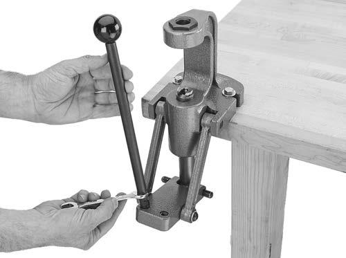 Assembly 1. Thread press handle onto right or left side of linkage block, as shown in Figure 3, and tighten with a 1mm open-end wrench.