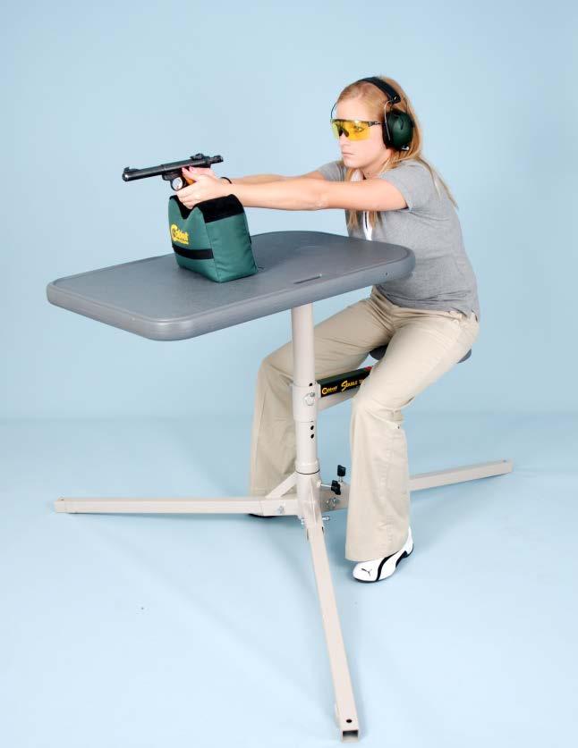 ELEMENTS OF THE BENCHREST POSITION SLIDE II-14 SIT BEHIND THE BENCH, FACING THE TARGET FEET ARE FLAT ON THE GROUND BOTH ARMS