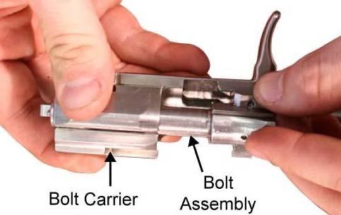 bolt assembly so the bolt cam seats into the cam recess of the bolt carrier, and pulling the bolt assembly