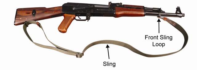 TM 8370-50007-OR/1 0015 00 9. Attach the Sling. a. Unloop the sling from its buckle (if necessary), then thread it through the rear sling swivel on the buttstock. b. Rethread the sling through its buckle.