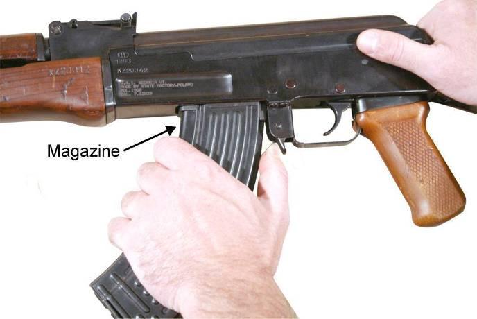 click is heard indicating that the magazine release has locked the magazine in place.