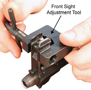 The combination tool (or the handle of the front sight adjustment tool) is used to screw the front sight post down or up. Refer to Figure 4. b. The Windage Drum.