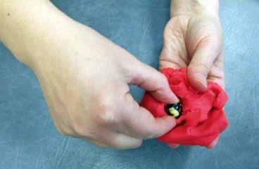 Marbles in play-doh Hide marbles in the play-doh and encourage your child to find them using finger tips to remove.
