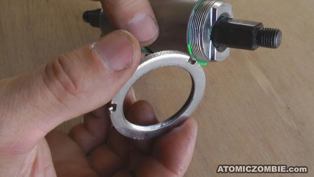The left side threaded bearing cup is reinstalled by turning it in the clockwise rotation until it is as tight as you can make it by hand only.