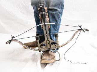 POSITIONING THE STRINGING AID Figure 1 Place the limb-holders over each limb tip as shown in [FIG.