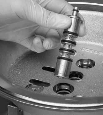 Use caution when handling air valve spool to prevent damaging seals.