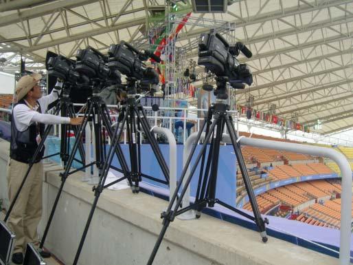 Figure 1: Camera setup on the stadium (left) and DLT calibration process of 40-70 meter capture volume (right).
