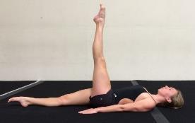 Athlete returns left leg to back layout position and assumes a right bent knee back layout position within 1 count of 8, left knee and ankle in full extension.