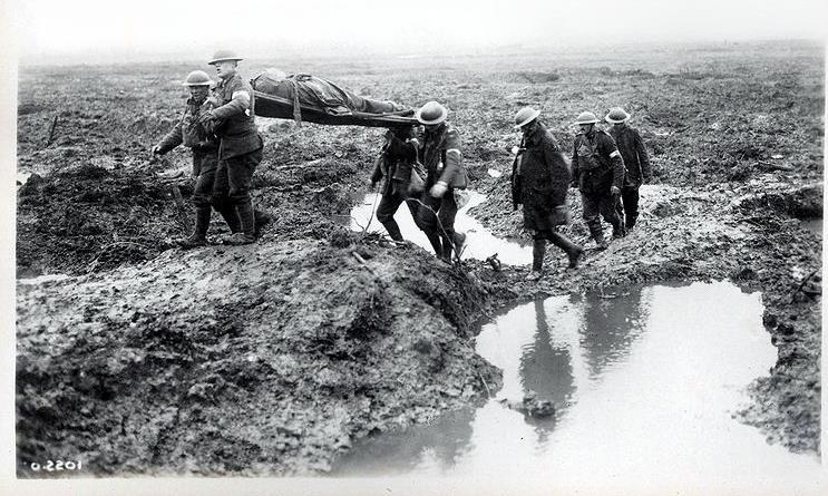 A party of stretcher-bearers evacuate a wounded soldier from the battlefield during the Third Battle of Ypres in 1917. Two accounts of the battlefields around Ypres in 1917.