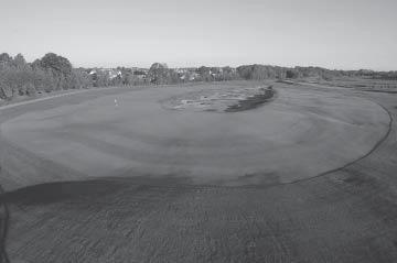 An errant shot to the left will leave the player a difficult pitch from the adjacent bluegrass rough back toward the water.