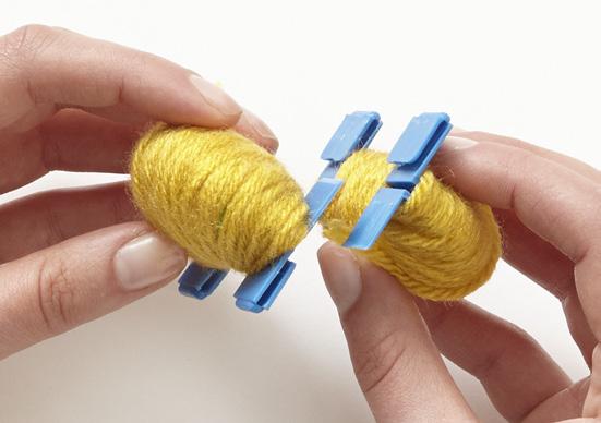 Lastly, wrap 150 rounds of yellow yarn so that it covers all of the yarn