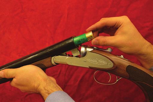 (Moved to rear, S exposed) Install suitable cartridges according to your shotgun s gauge