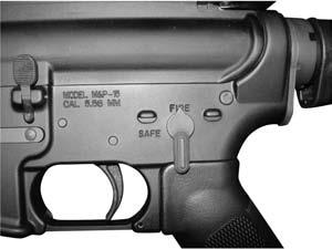 Grasp firearm with one hand on handguard and other hand on firearm grip with index finger resting along outside of trigger guard. Raise firearm and pull buttstock firmly into shoulder.
