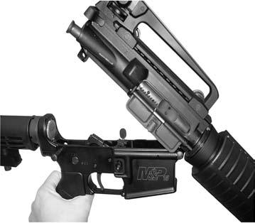 (Figure 17 & 18) Pivot lower receiver down and away from upper receiver.