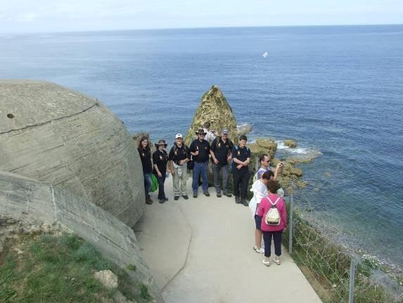 The group explore the cliff-top observation bunker at the Pointe du Hoc Battery.