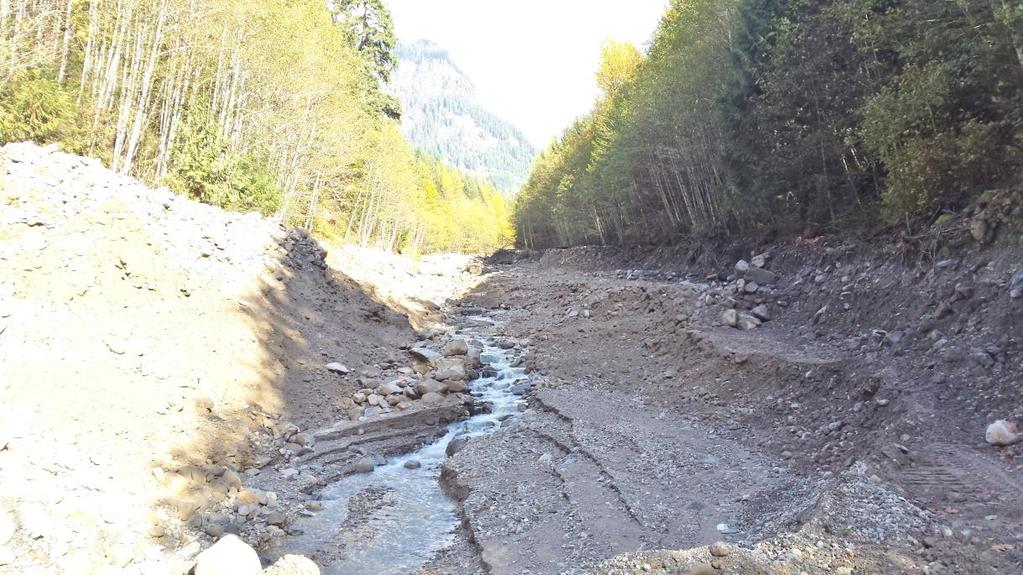Figure 7: Photo looking upstream from the repaired road crossing where Turbid Creek took out the culvert and road in a significant earth-moving, debris torrent.
