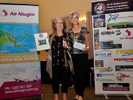 accepting her prize of a 5 night Dive Package from TUFI Resort,